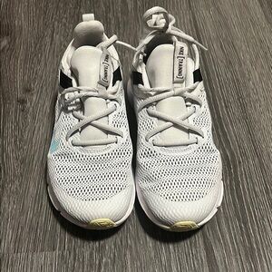 Nike White and Blue Sneakers with Breathable Mesh and Unique Lacing System